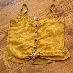 Yellow short sleeved top from sky and sparrow.